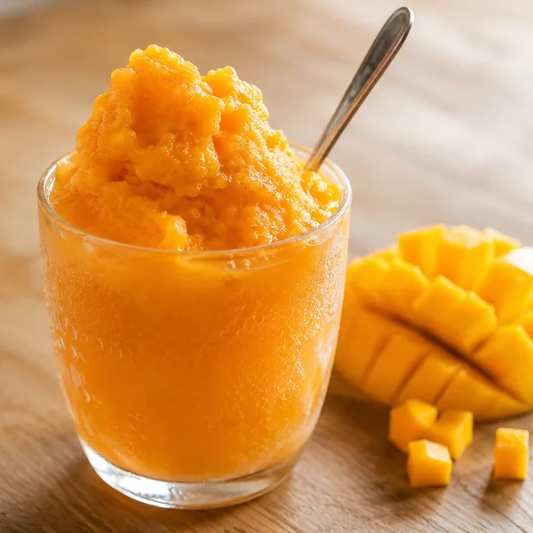 A glass of cremolada, thick shaved ice fruit drink